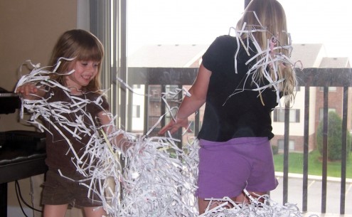 Girls Playing with Shredded Paper