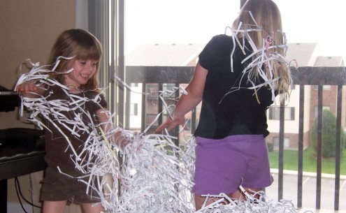 Girls Playing with Shredded Paper Girls Playing with Shredded Paper